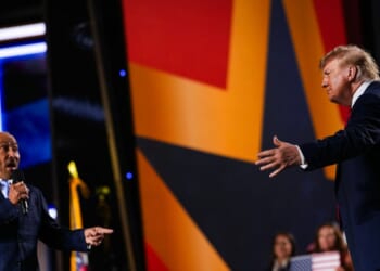 Musician Lee Greenwood greets President Donald Trump as he takes the stage to speak on the second day of the 2026 Republican National Convention at the American Airlines Center on Sept. 10, 2026, in Dallas, Texas.