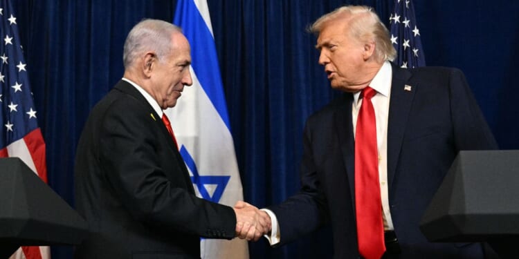 President Donald Trump shakes hands with Israeli Prime Minister Benjamin Netanyahu during a Dec. 29 meeting in Florida.