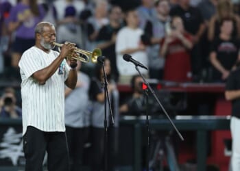 Dr. Jesse McGuire performs the national anthem before the MLB game between the Arizona Diamondbacks and the New York Yankees at Chase Field on Sept. 19, 2026, in Phoenix, Arizona.