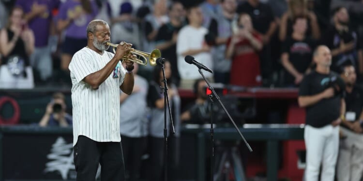 Dr. Jesse McGuire performs the national anthem before the MLB game between the Arizona Diamondbacks and the New York Yankees at Chase Field on Sept. 19, 2026, in Phoenix, Arizona.