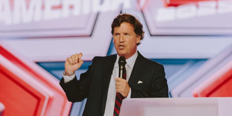 Conservative political commentator and podcast host Tucker Carlson speaks at Turning Point USA's annual AmericaFest conference, in remembrance of late right-wing political activist Charlie Kirk, in Phoenix, Arizona, on Dec. 18, 2025.