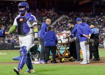 Jared Young #29 of the New York Mets is carried off the field on a stretcher Thursday after a collision at first base with teammate Nolan McLean during the sixth inning against the Philadelphia Phillies at Citi Field in New York City.