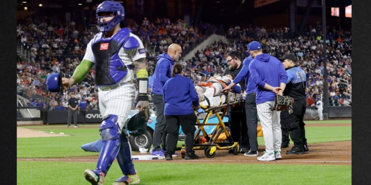 Jared Young #29 of the New York Mets is carried off the field on a stretcher Thursday after a collision at first base with teammate Nolan McLean during the sixth inning against the Philadelphia Phillies at Citi Field in New York City.