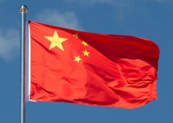 A Chinese flag flies in the wind.