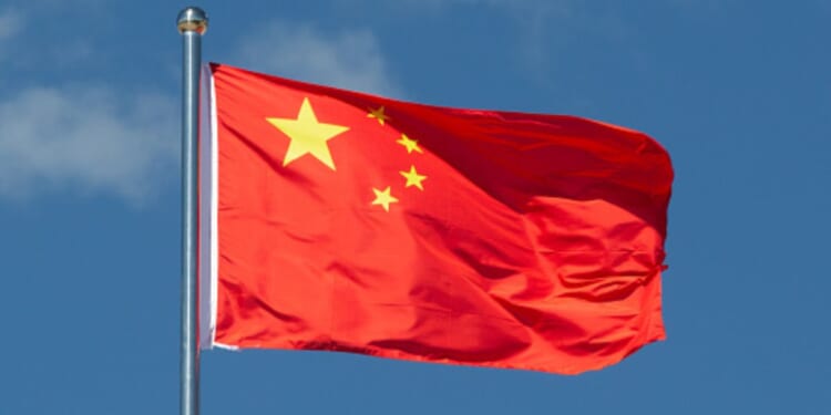 A Chinese flag flies in the wind.