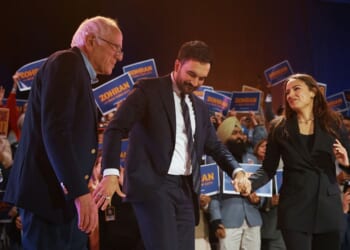 New York Mayor Zohran Mamdani salutes with Sen. Bernie Sanders and Rep. Alexandria Ocasio-Cortez during an election rally at Forest Hills Stadium on Oct. 26, 2025, in the Queens borough of New York City.