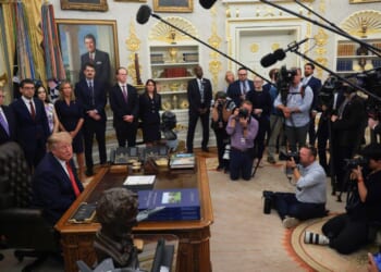 President Donald Trump speaks to reporters Sept. 18 in the Oval Office at the White House in Washington, D.C. Several news agencies have filed a lawsuit after Trump banned them from the White House, calling them "fake news" outlets.