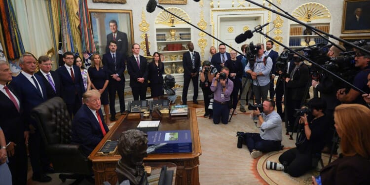 President Donald Trump speaks to reporters Sept. 18 in the Oval Office at the White House in Washington, D.C. Several news agencies have filed a lawsuit after Trump banned them from the White House, calling them "fake news" outlets.