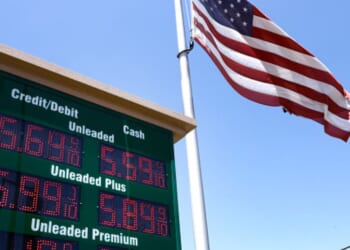 A gas meter is displayed beside an American flag on May 11, 2026 in Arcadia, California.