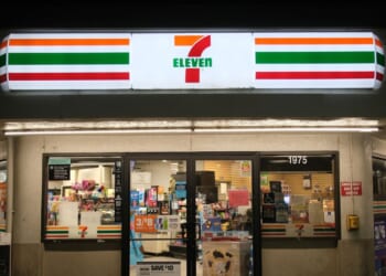 A 7-Eleven convenience store facade at night in Merced, California, on June 10, 2024.