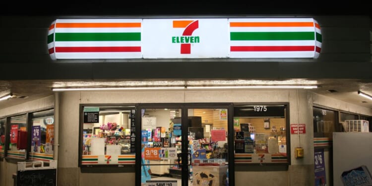 A 7-Eleven convenience store facade at night in Merced, California, on June 10, 2024.