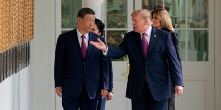 President Donald Trump escorts Chinese President Xi Jinping at the White House on Thursday, accompanied by first lady Melania Trump and Chinese first lady Peng Liyuan.